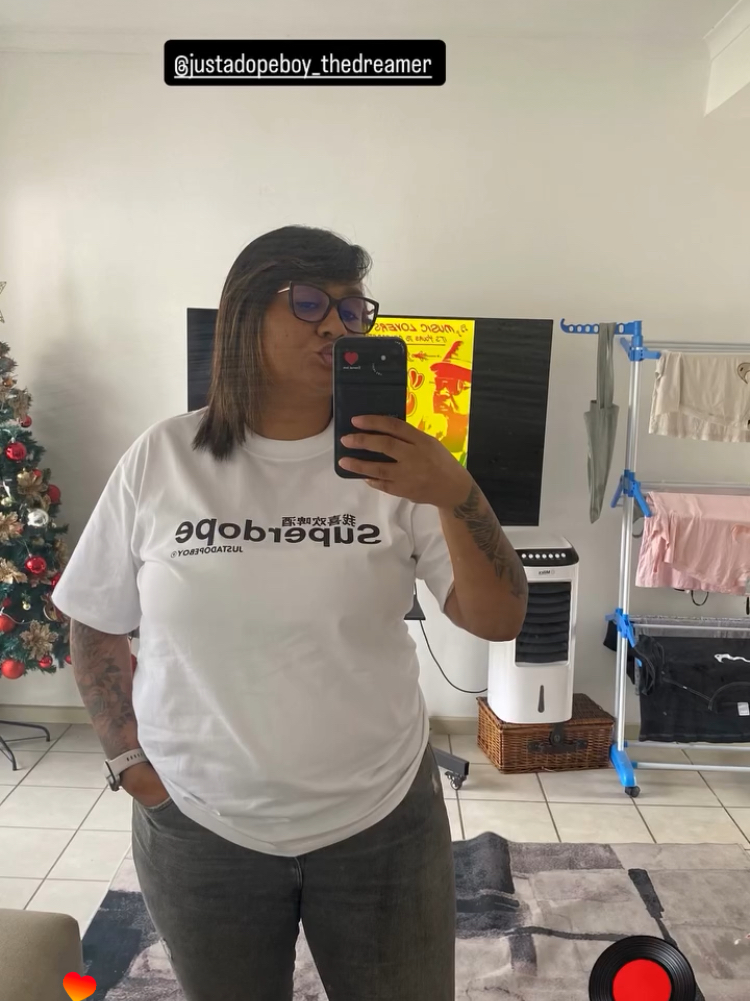 Customer wearing JUSTADOPEBOY tee